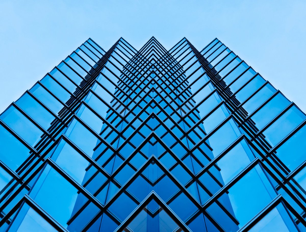 Modern glass building architecture facade representing premium real estate investment in Turkey