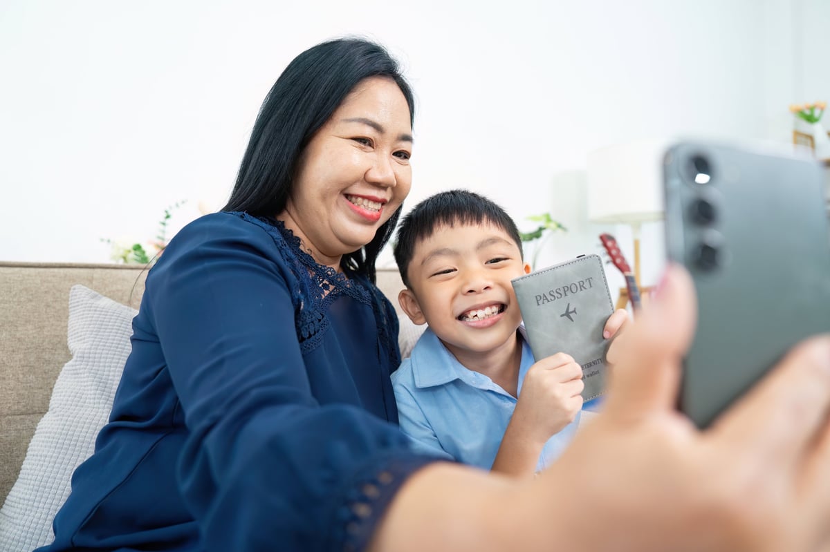 Mother and child celebrating with Turkish passport representing citizenship by birth and descent through Turkish parentage