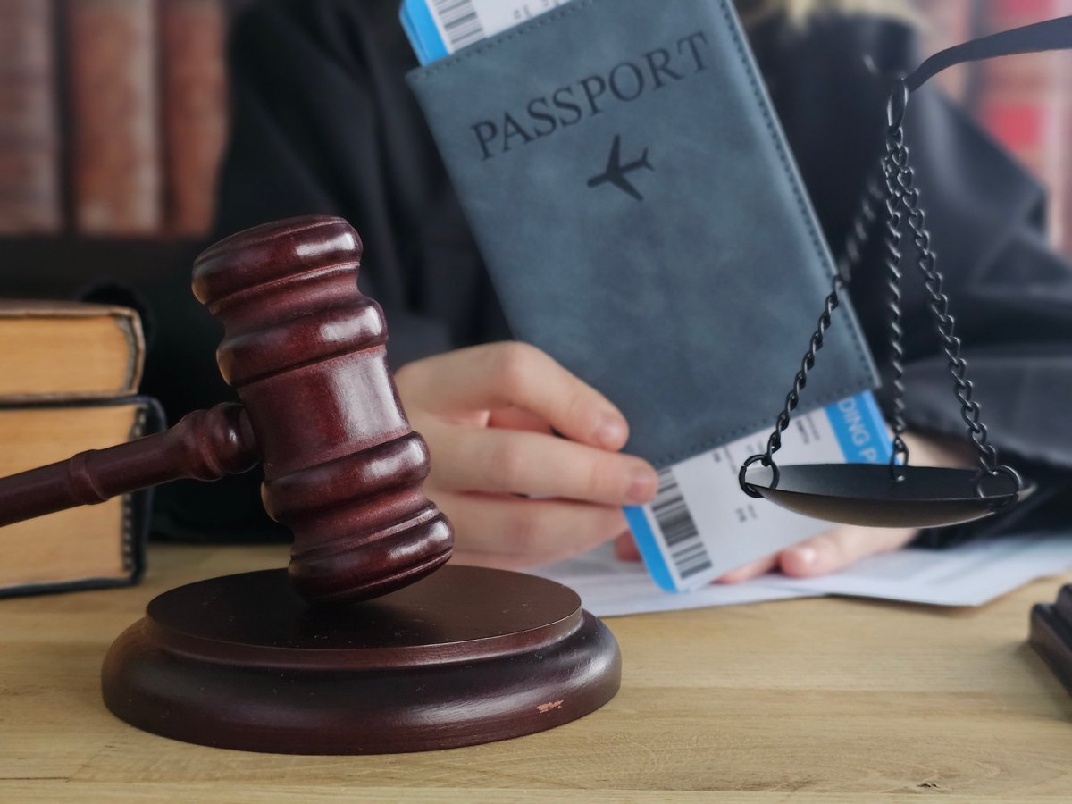 Turkish passport and legal documents with gavel on attorney desk representing entry ban removal appeal and immigration restriction legal services in Turkey