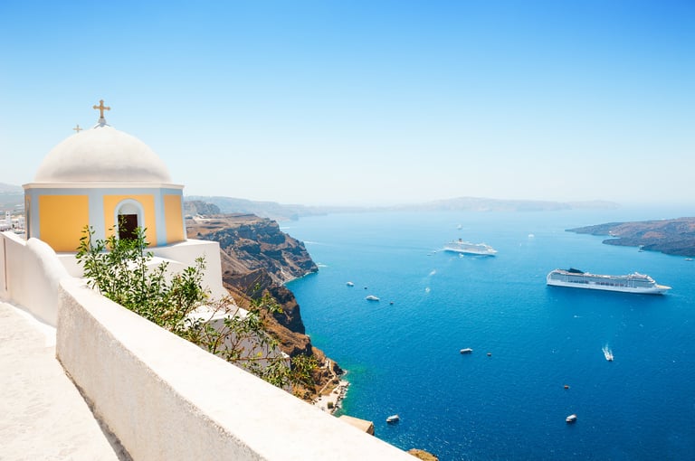 White architecture on Santorini island Greece representing Golden Visa property investment residency and Mediterranean lifestyle for international investors